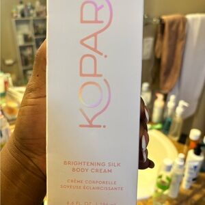 Kopari Brightening Silk Body Cream in White and Pink